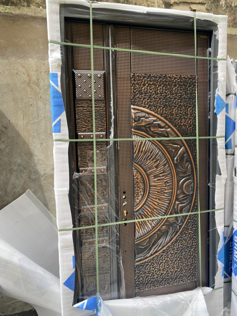 Copper Sunburst Medallion Cast Door — Doors