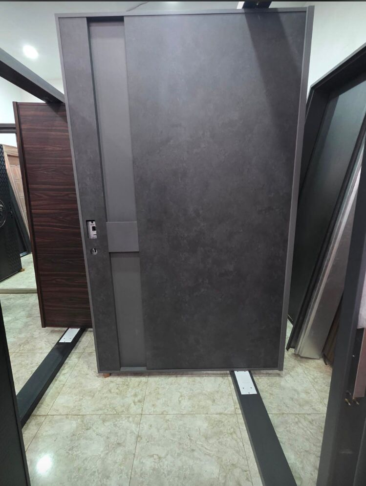 Graphite Concrete Pivot Door — Doors
